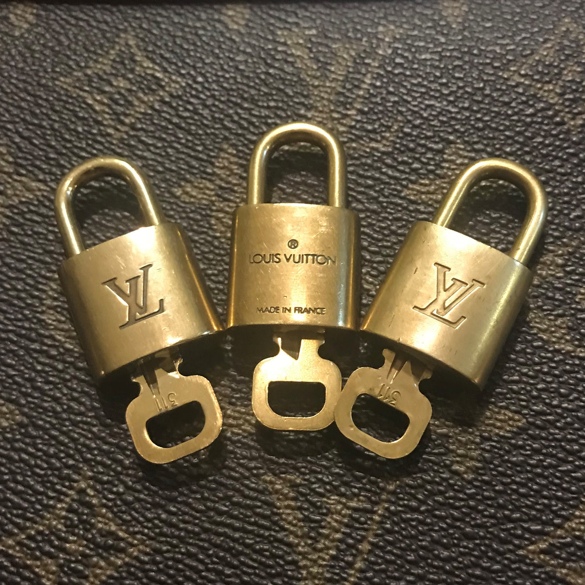 authenticity Guarantee - Louis Vuitton Lock & Key Set: Speedy, Alma, Neverfull, Keepa
