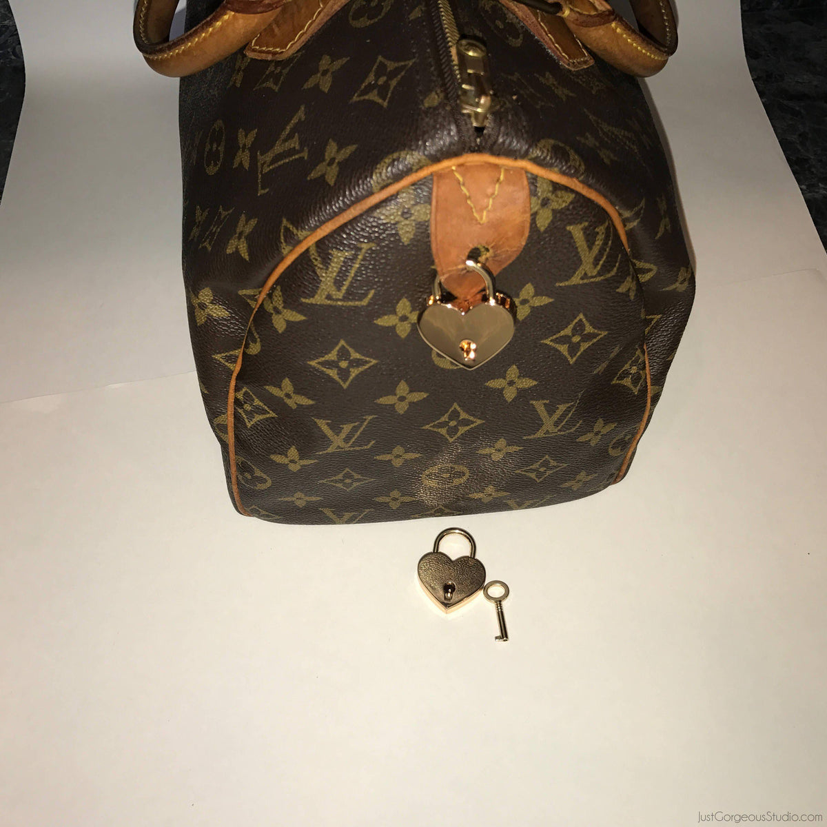 Louis Vuitton golden lock for Speedy handbag