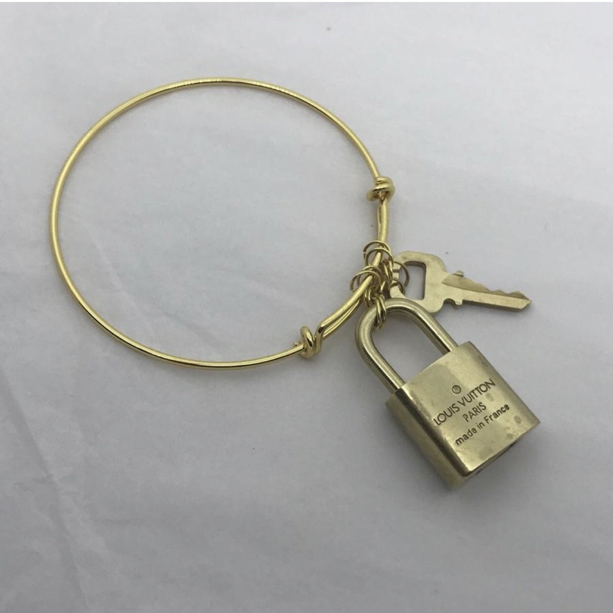 Louis Vuitton Goldtone Metal Lock Me Frame Cuff Bracelet - Yoogi's Closet