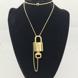 Louis Vuitton Lock Set On Necklace-Jewelry, Watches, & Sunglasses-Louis Vuitton-Brass/Gold-JustGorgeousStudio.com
