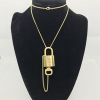 Louis Vuitton Lock Set On Necklace-Jewelry, Watches, & Sunglasses-Louis Vuitton-Brass/Gold-JustGorgeousStudio.com