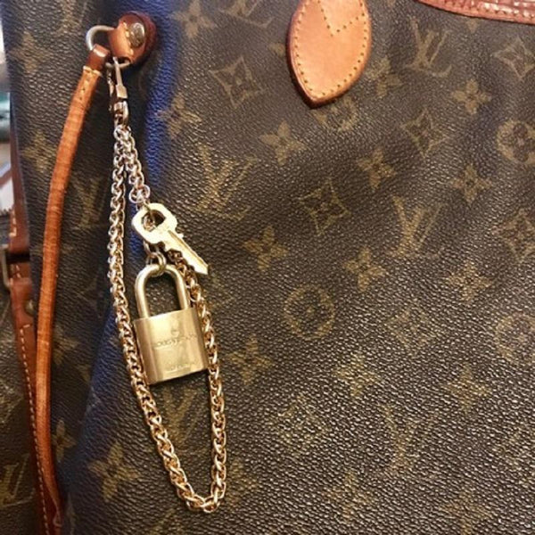 louis vuitton purse with lock and key