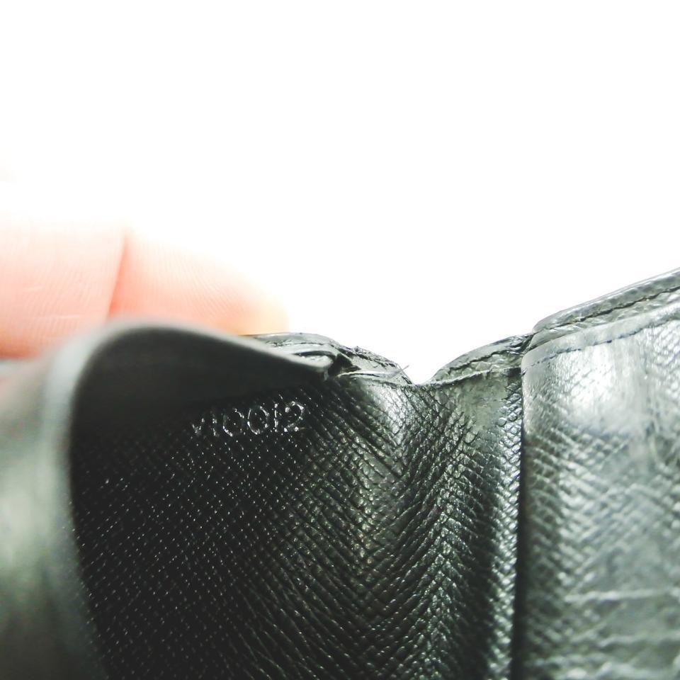 authenticity Guaranteed - Louis Vuitton Taiga Bifold Wallet: Vi0012